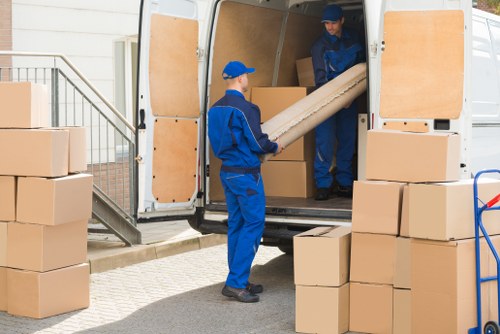 Removal van and movers preparing a same-day house move in Hackney