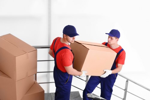 Removal van loading boxes and furniture in Hackney