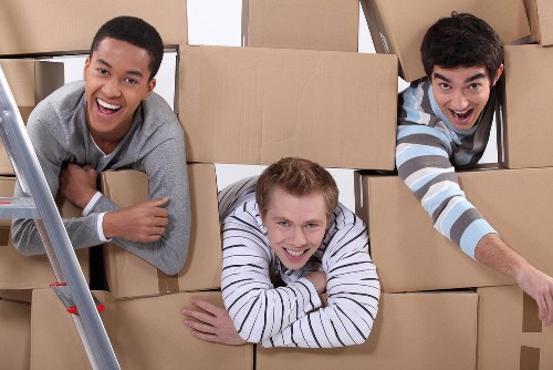 Office relocation team preparing business equipment for a move in Hackney