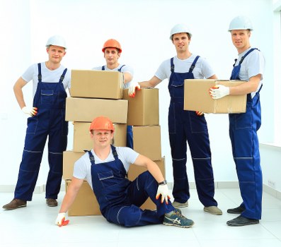 Removal van and moving team preparing a house move in Hackney