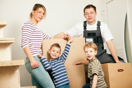 Packed boxes and moving equipment prepared for a Hackney relocation