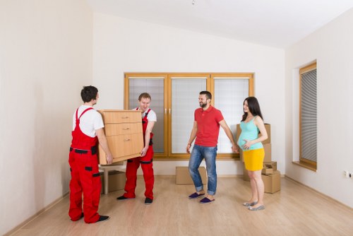 Local packing team handling fragile items for a Hackney relocation