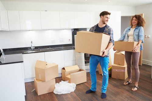 A moving crew handling stairs and access challenges in a Hackney flat