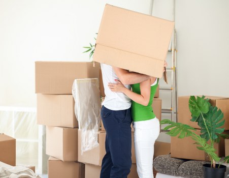 Packed moving boxes and furniture prepared for transport